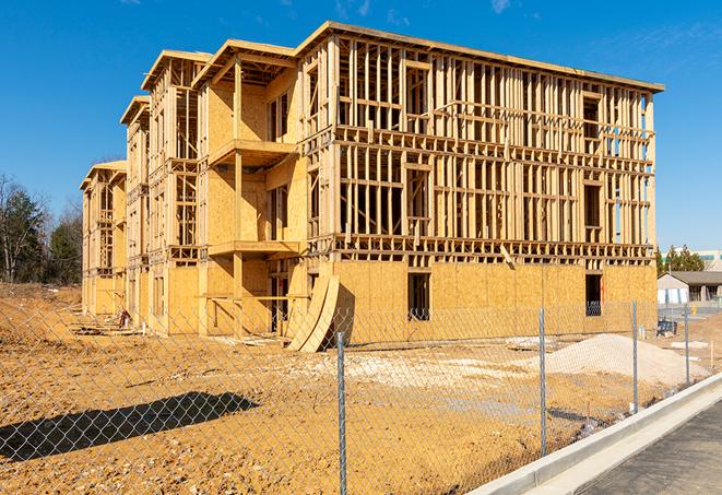 a snapshot of temporary chain link fences protecting a large construction project from unauthorized access in Mobile